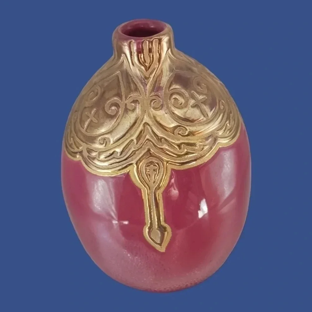 Vintage ceramic engraved  vase topped with enameled gold glazed